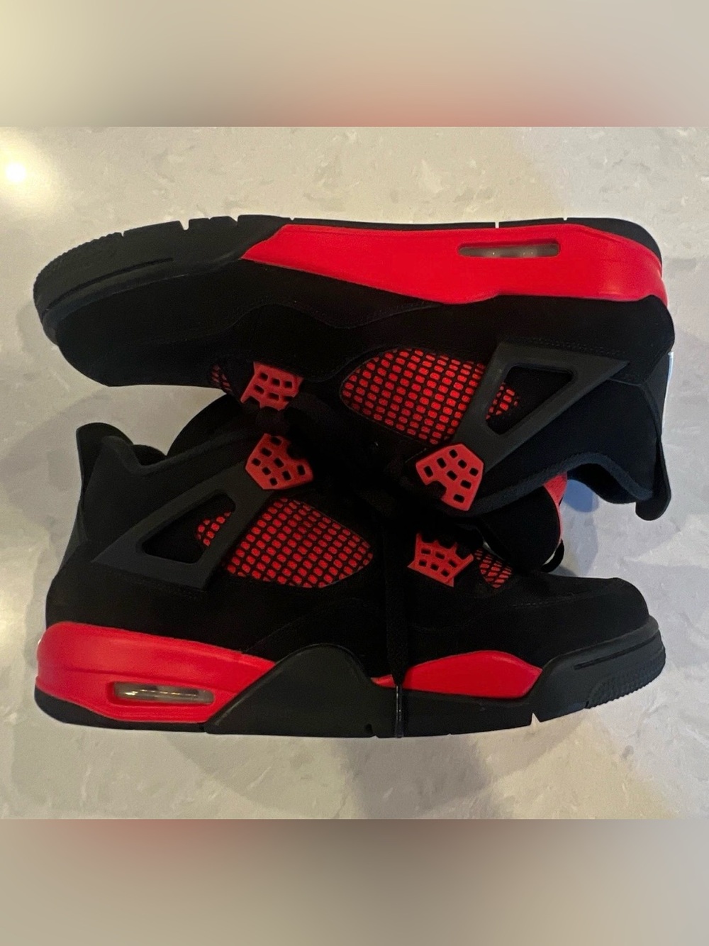 Authentic Air Jordan 4 Retro “Red Thunder” sneakers in Men’s Size 10.5.